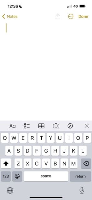 The smiley emoji on an iPhone keyboard