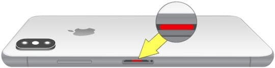 iPhone X with red liquid indicator.
