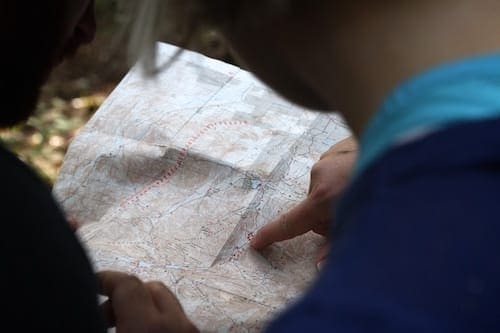 Photograph of a person checking a paper map