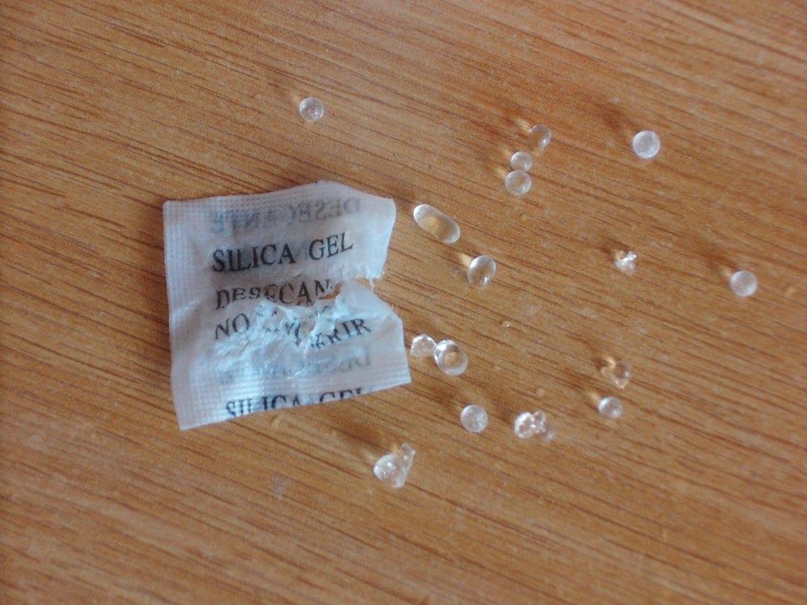 Silica gel pack showing clear granules inside