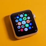 Photo of an Apple Watch on an amber background