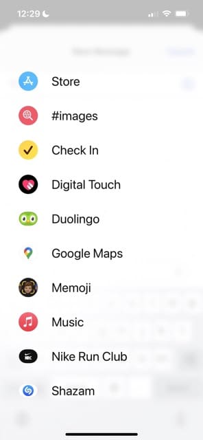 Select the Memoji icon in iOS 17