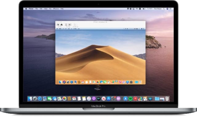 MacBook with Screen Sharing window open
