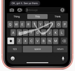 iOS 13's QuickPath keyboard on an iPhone in dark mode