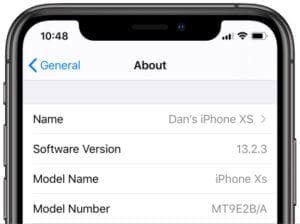 iPhone XS showing Settings General About screen with Software Version and Model Number