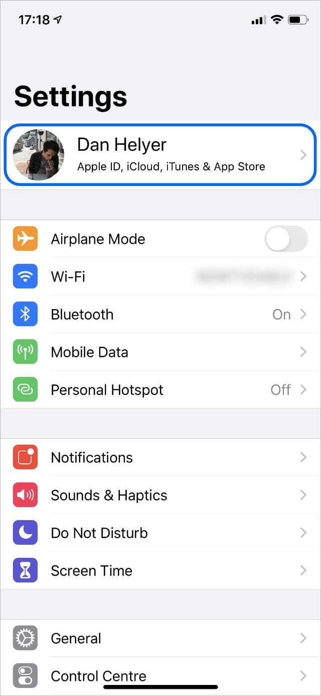 iPhone Settings highlighting [Your Name] Apple ID settings
