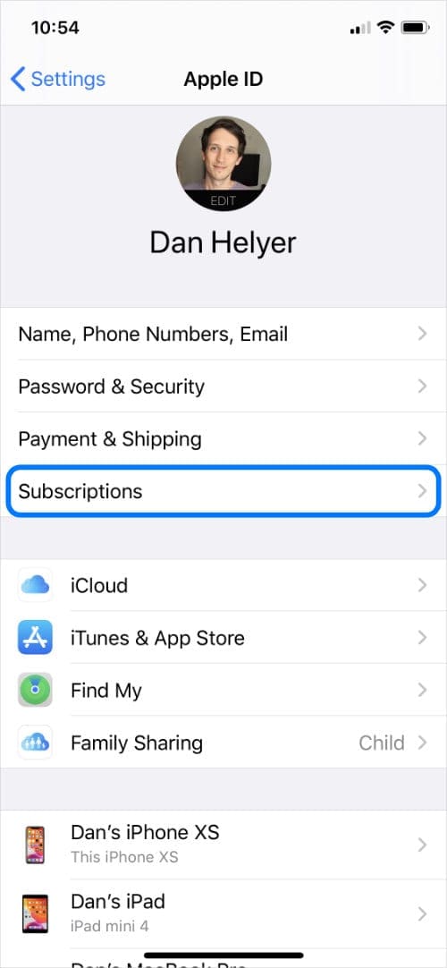 Apple ID settings on iPhone with Subscriptions button highlighted