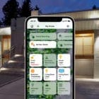 Apple Home app in front of modern smart home