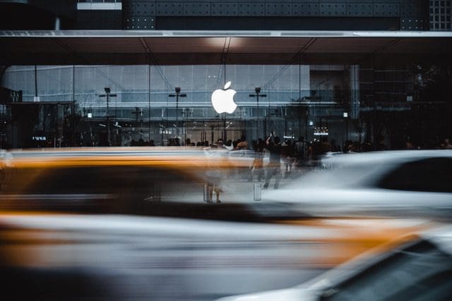 photo of an apple store on a busy street