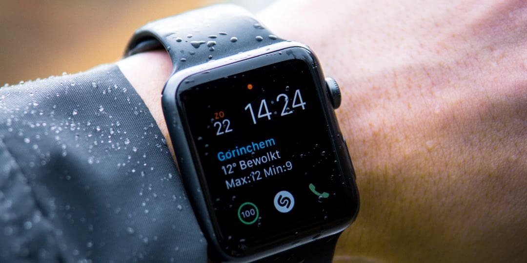 Person using Apple Watch in the Rain